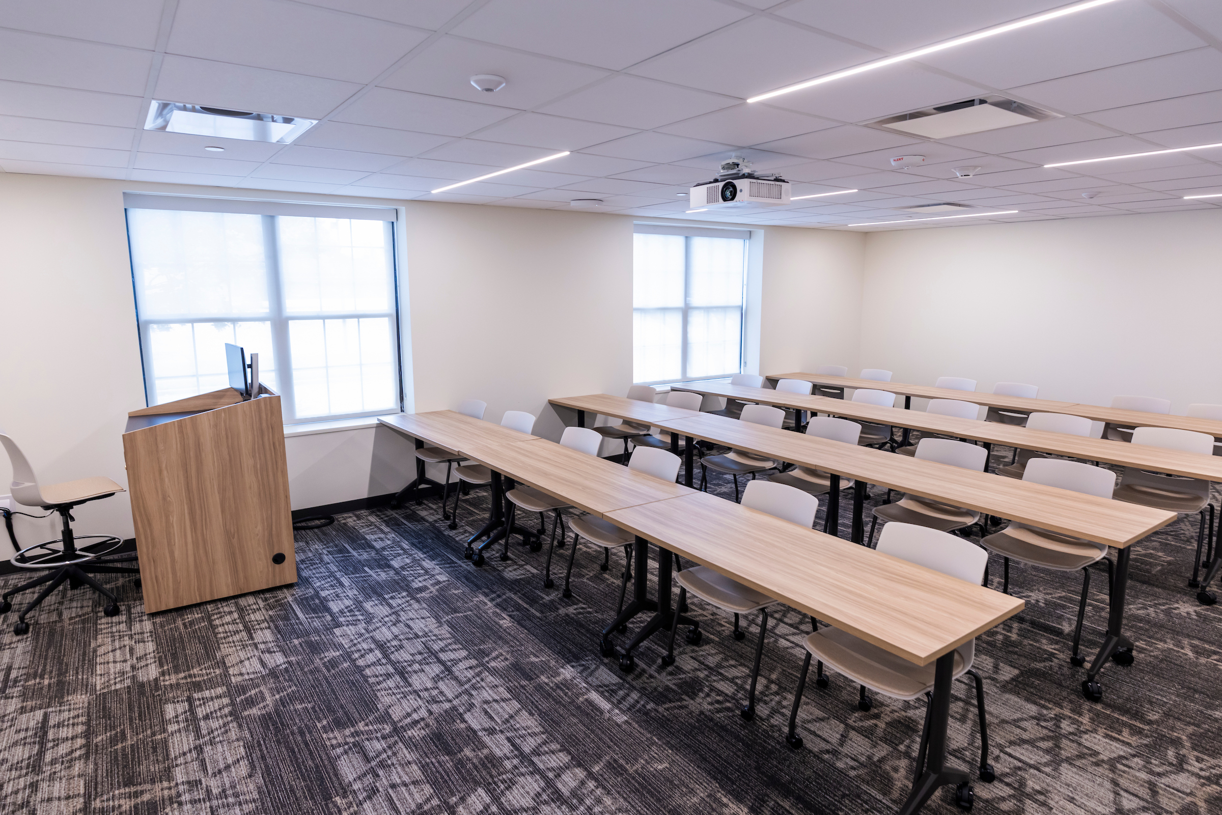 Classroom in Dawson. Includes seating for 24 students, movable tables and chairs, new classroom technology, and a teaching podium.