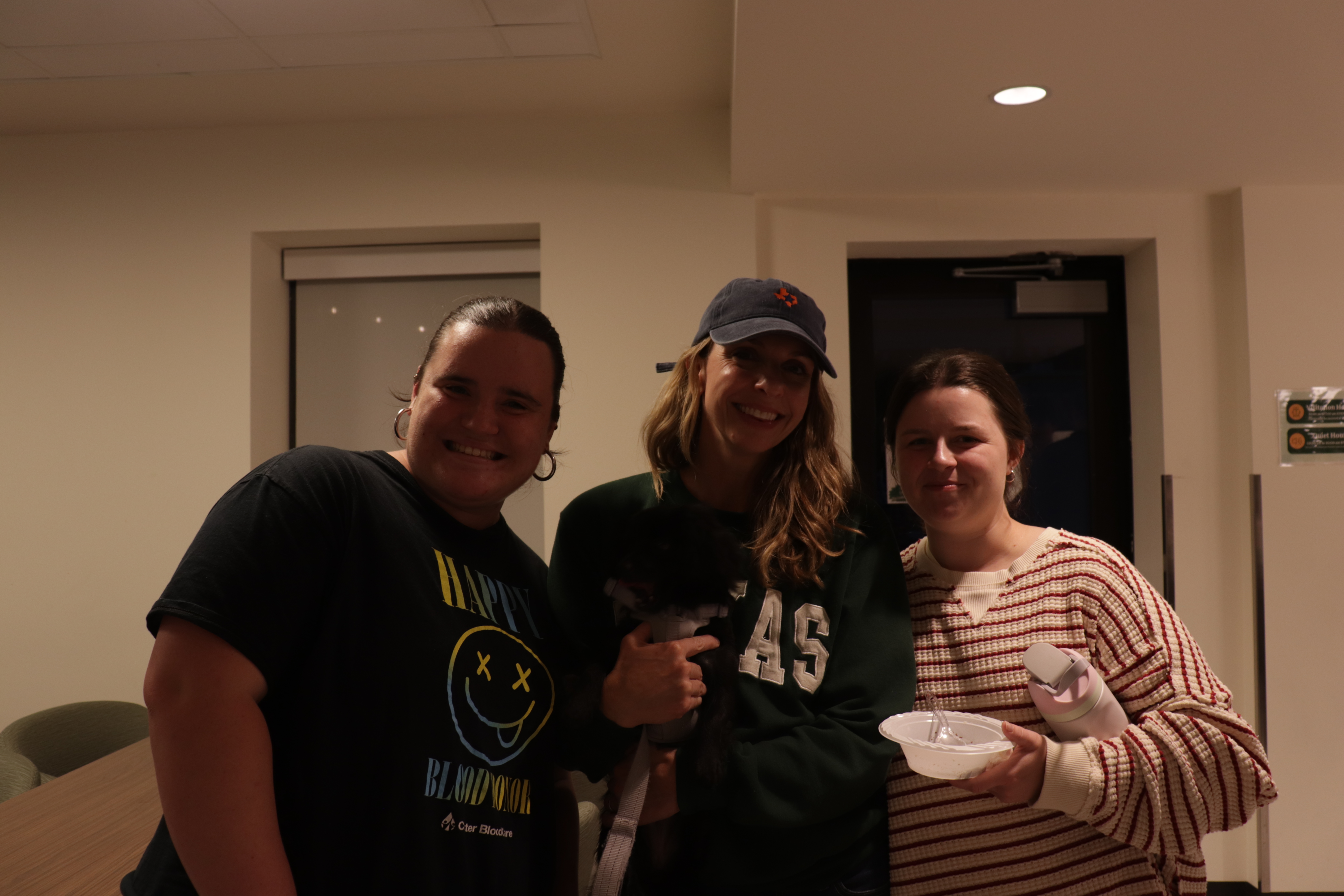 Dr. Johnston with two students at Brownie Night in the Commons.